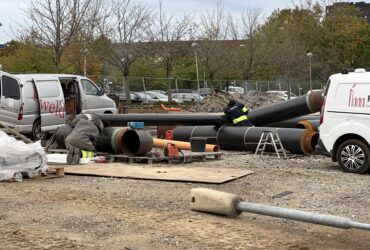 Piping installation – welders and pipefitters working with large diameter pipes in the field